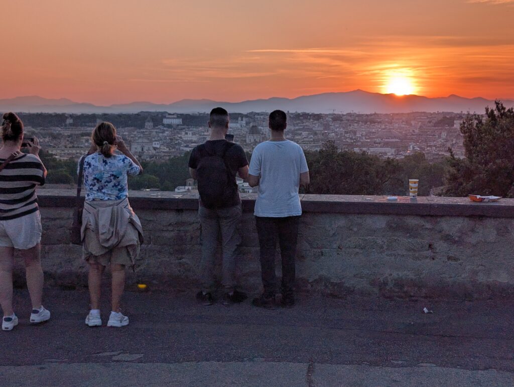 Guests watching the sun go down over Rome from the Janiculum Hill