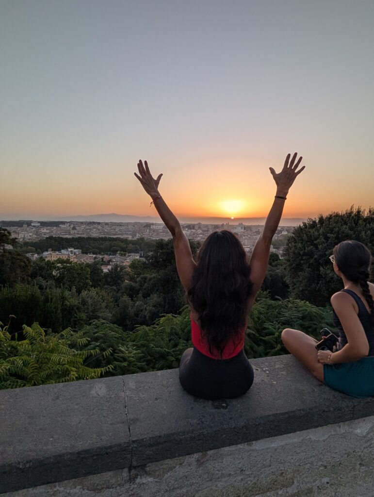 Guests raising their arms at sunrise on the Janiculum Hill