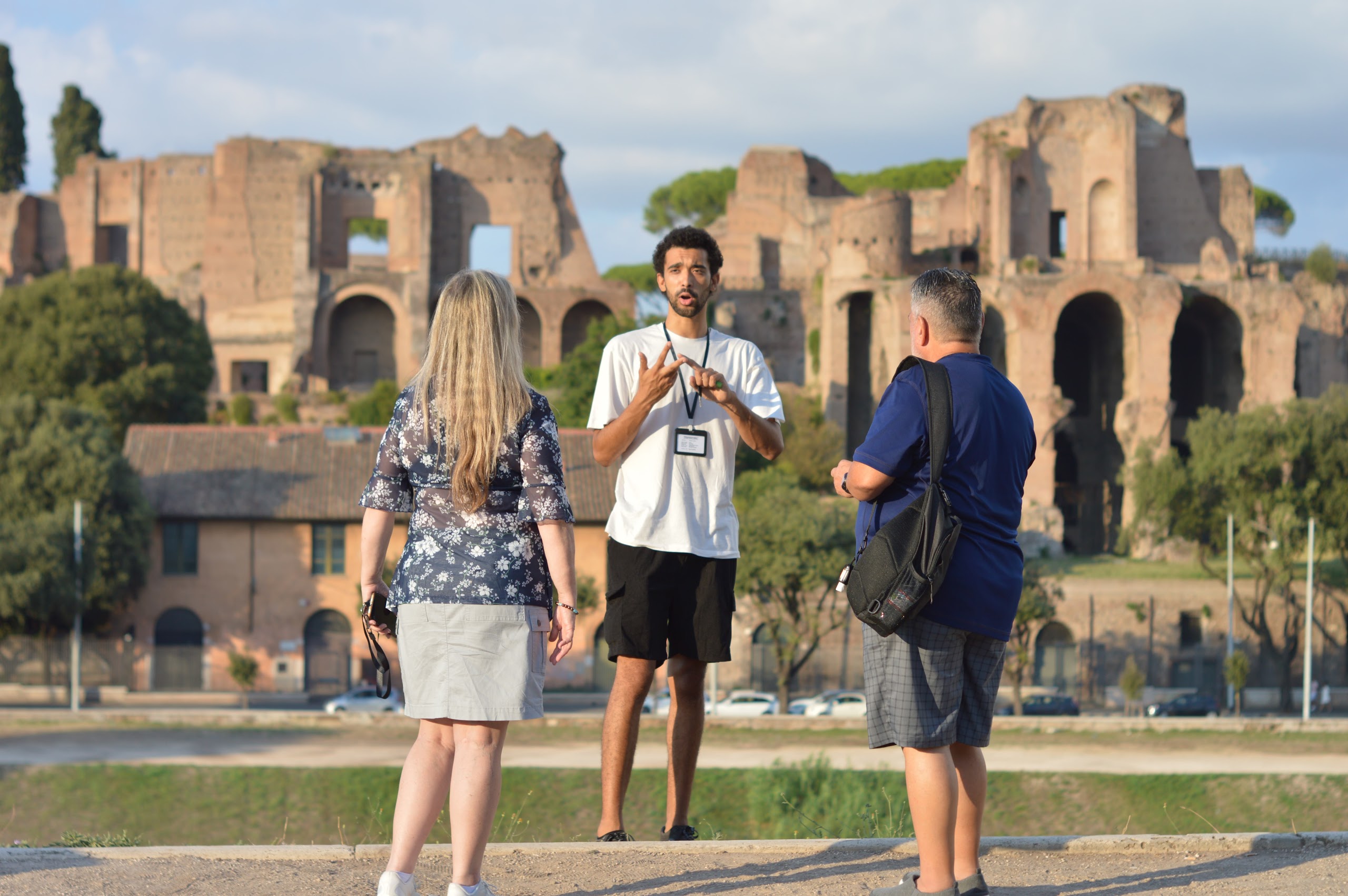 A guide telling the story of the Circus Maximus to a small group